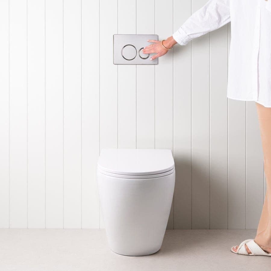 Curved In-Wall Toilet With Round Chrome Buttons