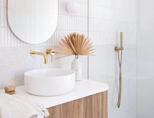 Adore Magazine - Higlett House Ensuite: Modern vanity with round basin and golden faucets